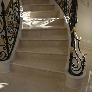 Crema Marfil MARBLE tiles, stairs, countertops and fireplace in mansion