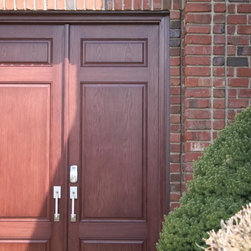 Solid Wood Front Door on Red Brick Home - Front Doors