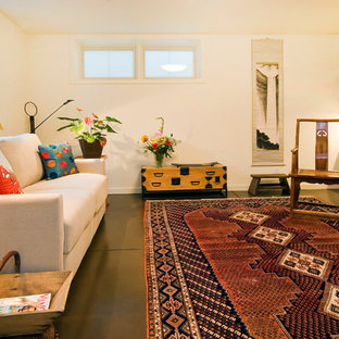 This is an example of a medium sized eclectic look-out basement in San Francisco with concrete flooring, white walls, no fireplace and green floors.