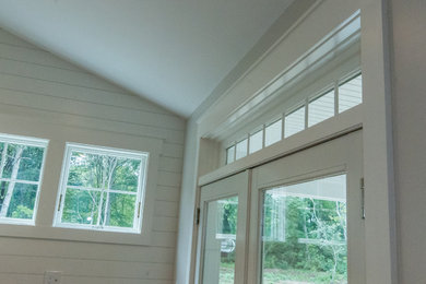 Inspiration for a large open concept living room remodel in Providence with white walls