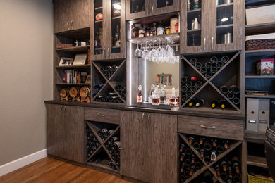 This is an example of a medium sized traditional wine cellar in Denver.