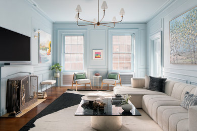 Inspiration for a timeless medium tone wood floor, brown floor and wainscoting living room remodel in New York with blue walls, a wood stove and a wood fireplace surround