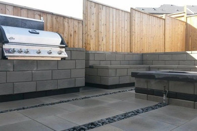 This is an example of a contemporary patio in Calgary.