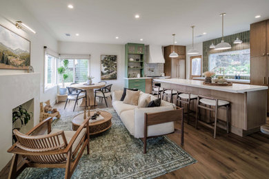 Tuscan open concept medium tone wood floor living room photo in San Francisco with white walls, a standard fireplace and a plaster fireplace