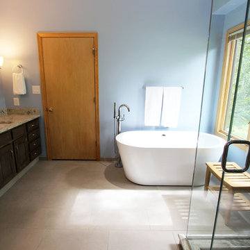 Master Bathroom with Free Standing Tub, Quartz Countertop and Grey Tiled Shower