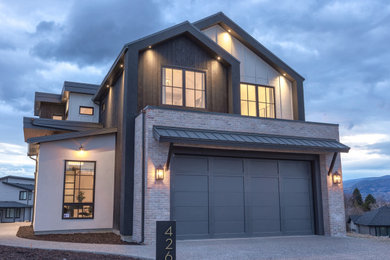 Large farmhouse three-story house exterior photo in Other