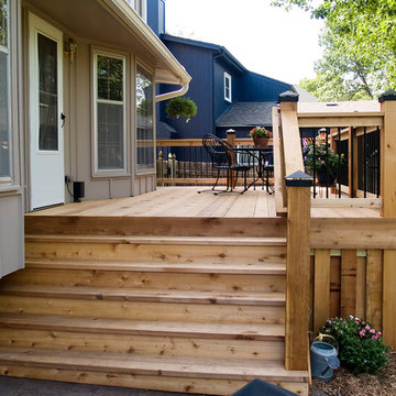 Stoerman - Cedar deck in Overland Park, Ks.  Stamped concrete patio & deck light