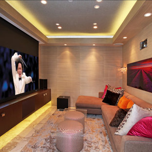 Inspiration for a small modern enclosed home cinema in Orange County with marble flooring and a projector screen.