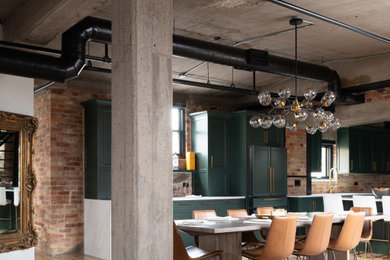 Example of a large eclectic light wood floor, exposed beam and brick wall kitchen/dining room combo design in Chicago