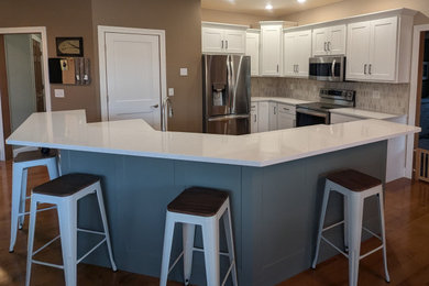 Mid-sized transitional l-shaped eat-in kitchen photo in Other with shaker cabinets, quartz countertops and an island