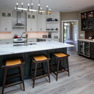 3 Finishes on Kitchen Cabinetry with Galley Workstation in Island and Wine Bar