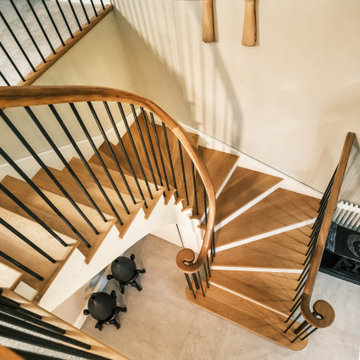 Elegant Curved Oak Staircase with Metal Spindles & Goose Neck