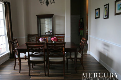 Enclosed dining room - mid-sized traditional porcelain tile and brown floor enclosed dining room idea in Jacksonville with beige walls