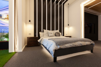 Photo of a modern master bedroom in Melbourne with black walls, carpet, grey floor, timber and planked wall panelling.