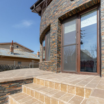 Exterior house cladded whit natural decorative stoneHouse