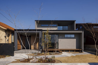 Ejemplo de fachada de casa gris minimalista grande de dos plantas