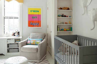 Mid-sized trendy gender-neutral carpeted nursery photo in New York with gray walls