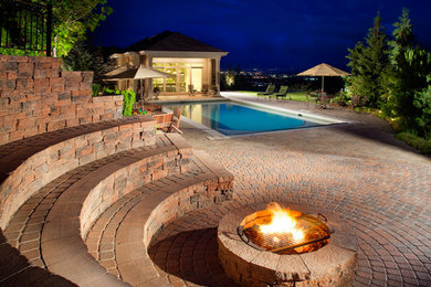 Mid-sized elegant backyard brick patio photo in Raleigh with a fire pit and no cover