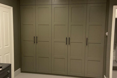 Wardrobe with panelled ladder back doors