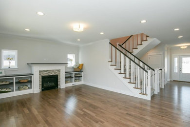 Large transitional formal and open concept light wood floor and beige floor living room photo in Cedar Rapids with white walls, a standard fireplace, a tile fireplace and no tv