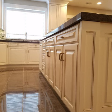 Beautiful White Kitchen with black counter tops