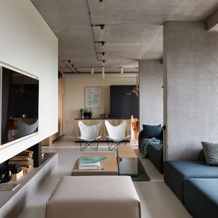 Design ideas for an urban open plan living room in Dorset with white walls, a wall mounted tv and grey floors.