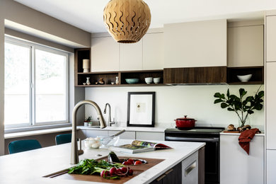 Inspiration for a mid-sized modern l-shaped eat-in kitchen remodel in Seattle with flat-panel cabinets, white cabinets and an island