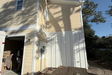 Two-story board and batten exterior home idea