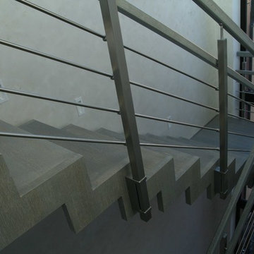 Modern metal stair covered by patina oak