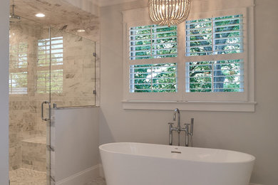 This is an example of a large transitional master bathroom in Other.