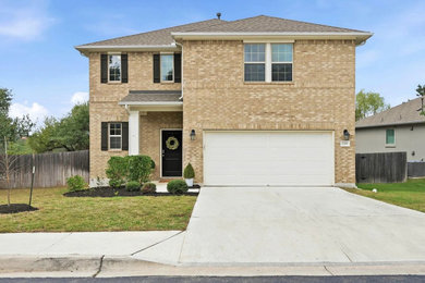 Example of a transitional exterior home design in Austin