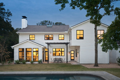 Large transitional white two-story wood gable roof idea in Austin