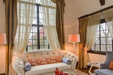 Example of a large classic formal and enclosed dark wood floor living room design in New York with beige walls, a standard fireplace and a stone fireplace