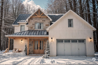 Mid-sized cottage white two-story mixed siding and board and batten exterior home idea in Montreal with a metal roof and a black roof