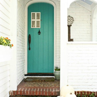 Photo of a shabby-chic style entryway in Tampa with a blue front door.