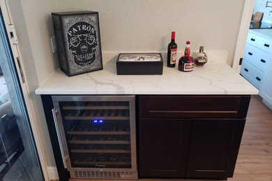 Example of a small minimalist single-wall wet bar design in Miami with shaker cabinets and brown cabinets