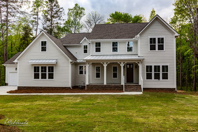 Example of a transitional home design design in Charlotte