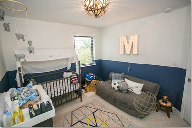 Example of a small minimalist boy carpeted nursery design in Miami with blue walls