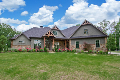 Large rustic gray two-story mixed siding house exterior idea in Little Rock with a hip roof and a shingle roof