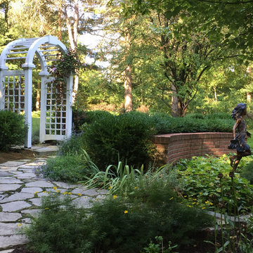 Perennial Garden with Bronze Sculpture and Wooden Arbor