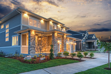 Large contemporary gray two-story concrete fiberboard flat roof idea in Salt Lake City