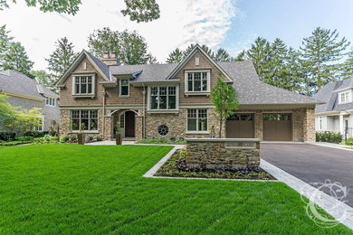 Inspiration for a large timeless beige two-story mixed siding exterior home remodel in Toronto with a shingle roof