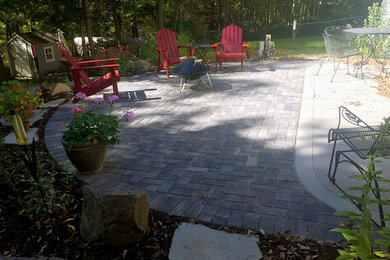 Inspiration for a small backyard brick patio remodel in Other