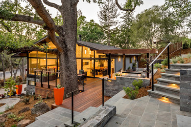 Example of a large mid-century modern gray two-story mixed siding exterior home design in San Francisco
