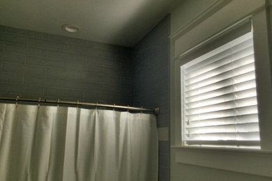 Inspiration for a timeless gray tile alcove shower remodel in Philadelphia with gray walls