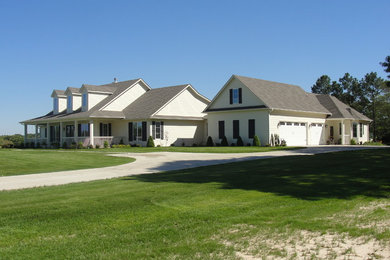 Example of a mid-sized classic white two-story concrete fiberboard gable roof design in Austin
