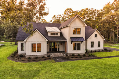 Inspiration for a large transitional beige two-story concrete fiberboard exterior home remodel with a shingle roof