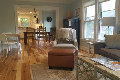 Inspiration for a small contemporary formal and open concept light wood floor and beige floor living room remodel in Other with blue walls, no fireplace and a wall-mounted tv