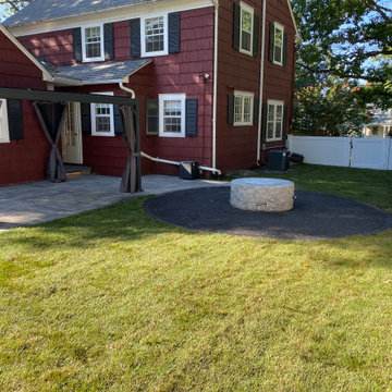 Backyard Makeover with Paver Patio, Pergola, Fire Place and Outdoor Lights.