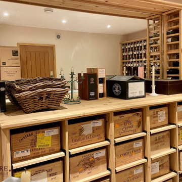 Large private wine cellar using solid pine racking in Hampshire, UK.
